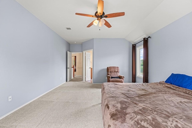 bedroom with a ceiling fan, visible vents, baseboards, lofted ceiling, and light carpet