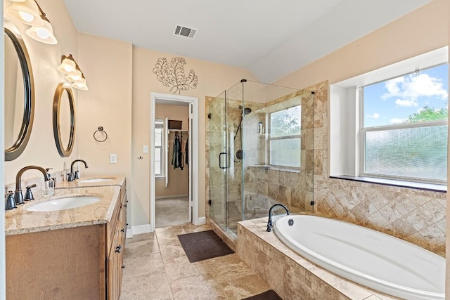 full bathroom featuring visible vents, a sink, a bath, and a stall shower