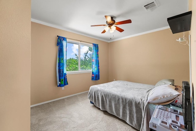 bedroom with crown molding, baseboards, carpet flooring, and visible vents