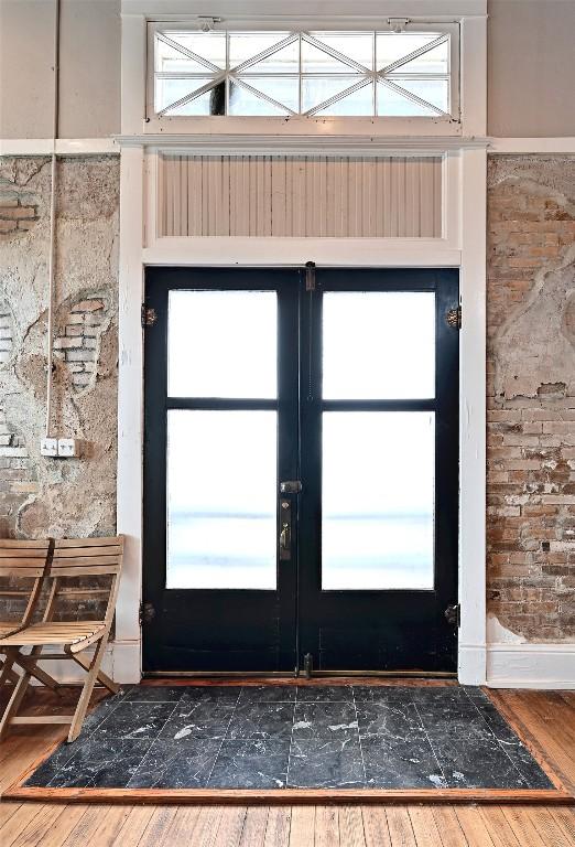 entrance foyer featuring french doors and wood finished floors