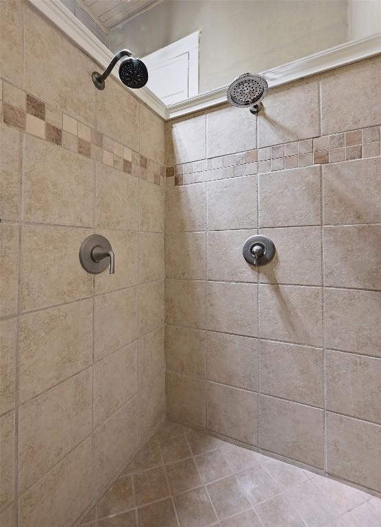 full bath featuring a tile shower