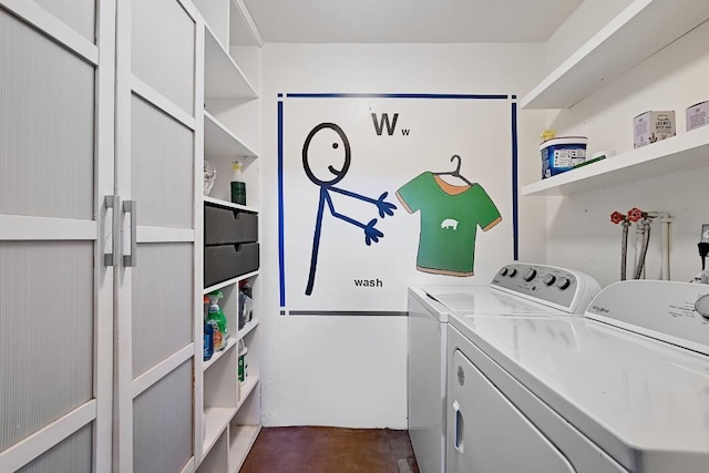 laundry area featuring separate washer and dryer and laundry area