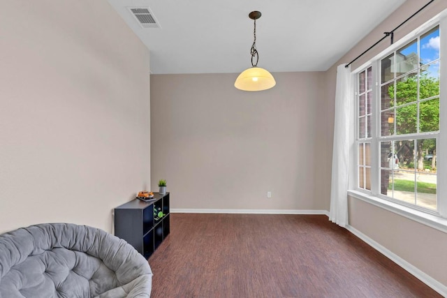 1205 Yountville Dr, Leander, TX 78641 - sitting room with wood finished floors and healthy amount of natural light