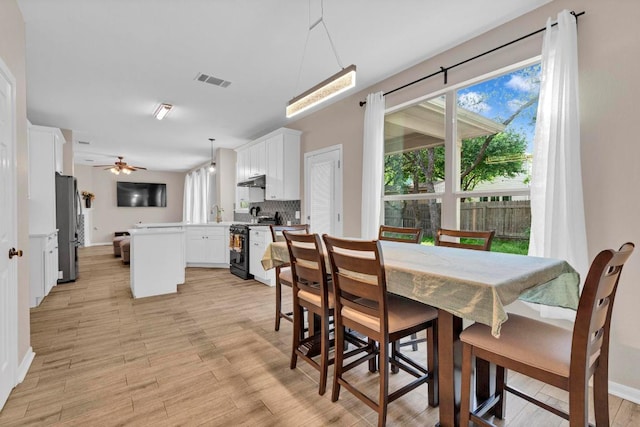 1205 Yountville Dr, Leander, TX 78641 - dining space featuring light wood-type flooring and ceiling fan