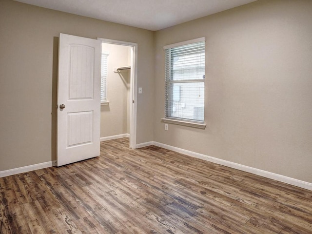 14500 Callan Ct, Manor, TX 78653 - spare room with wood finished floors and baseboards