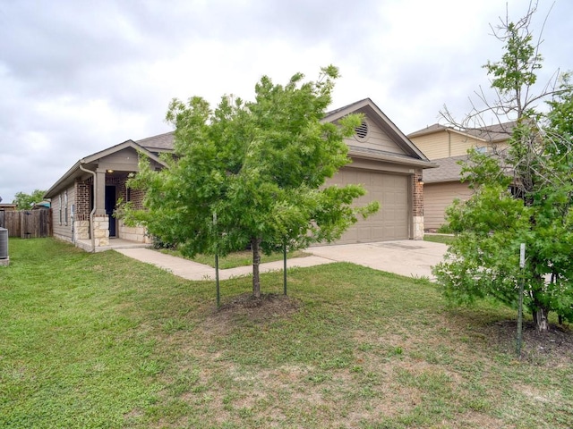 obstructed view of property with brick siding, an attached garage, driveway, and a front lawn
