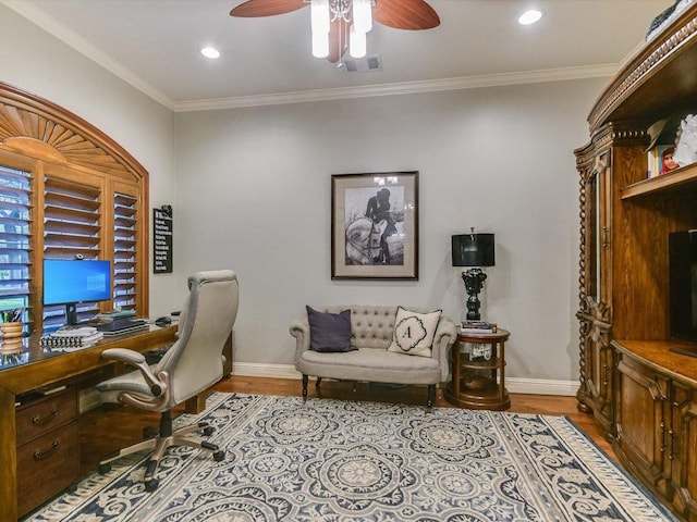 home office featuring visible vents, baseboards, ceiling fan, and wood finished floors