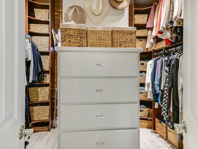 5709 Laguna Cliff Ln, Austin, TX 78734 - walk in closet featuring light wood finished floors