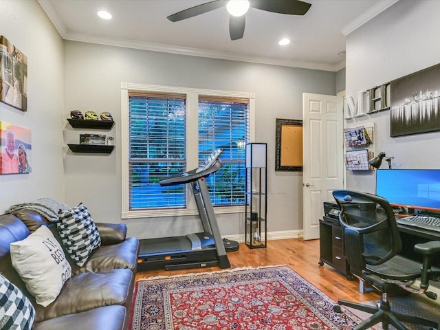 office space with a ceiling fan, baseboards, recessed lighting, wood finished floors, and ornamental molding