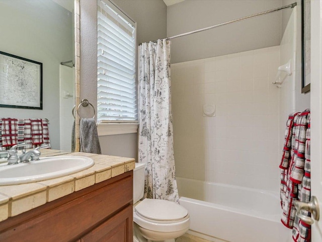 full bath featuring vanity, shower / bathtub combination with curtain, and toilet