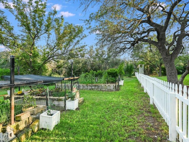 5709 Laguna Cliff Ln, Austin, TX 78734 - view of yard featuring a vegetable garden