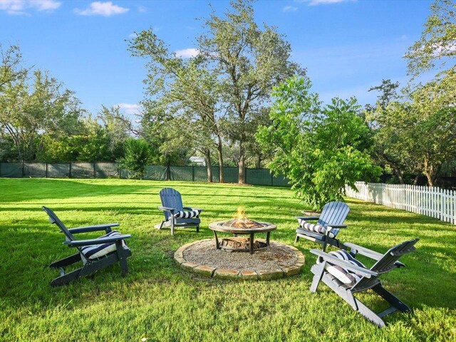5709 Laguna Cliff Ln, Austin, TX 78734 - fenced backyard with an outdoor fire pit