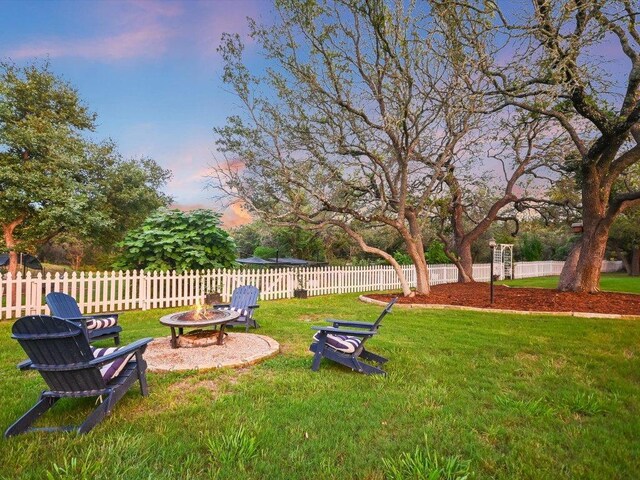 5709 Laguna Cliff Ln, Austin, TX 78734 - yard at dusk with a fire pit