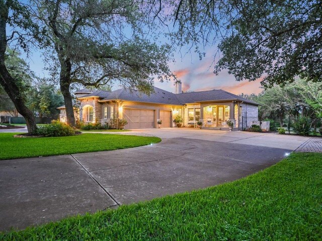 5709 Laguna Cliff Ln, Austin, TX 78734 - ranch-style house with a garage, concrete driveway, and a yard