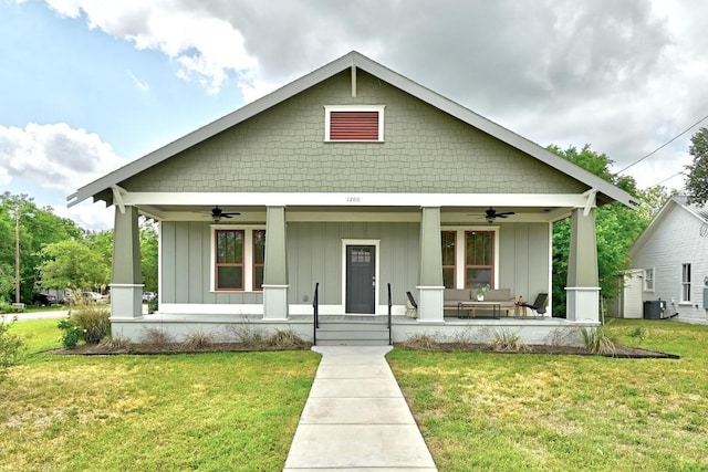 1200 Woodlawn St, Lockhart, TX 78644 - bungalow with a ceiling fan, covered porch, and board and batten siding