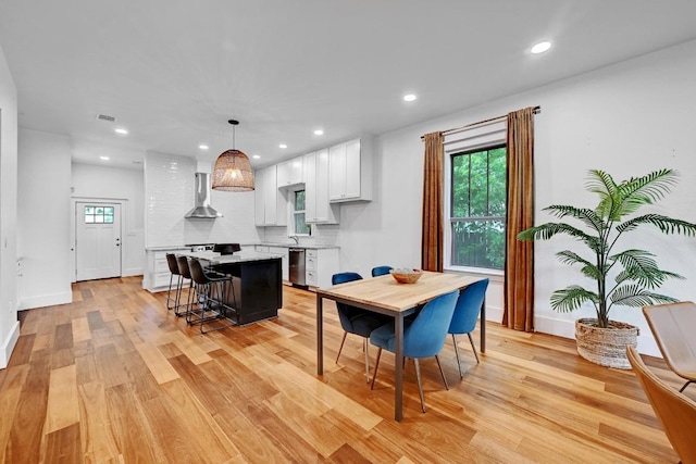 1200 Woodlawn St, Lockhart, TX 78644 - dining room featuring light wood finished floors, recessed lighting, and baseboards