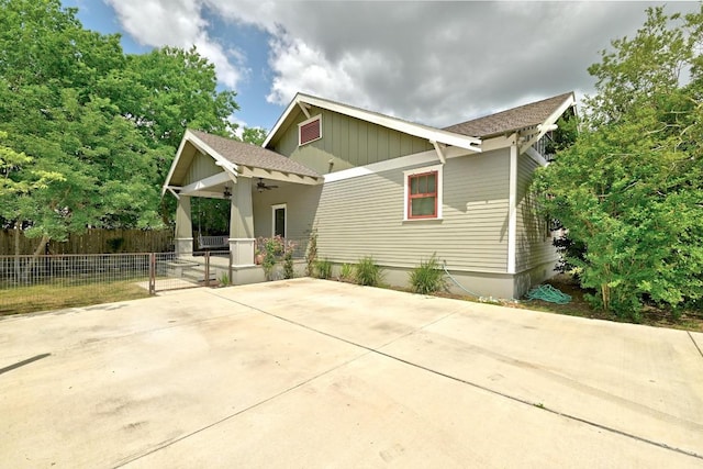 1200 Woodlawn St, Lockhart, TX 78644 - view of front of home with ceiling fan and board and batten siding