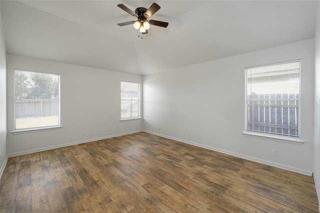 15205 Bullace St, Austin, TX 78724 - spare room with a ceiling fan, wood finished floors, lofted ceiling, and baseboards