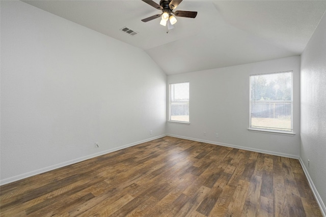 15205 Bullace St, Austin, TX 78724 - unfurnished room with ceiling fan, vaulted ceiling, dark wood-style flooring, and baseboards