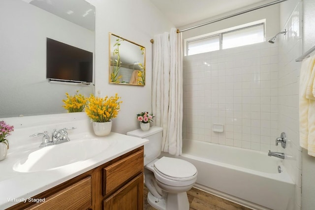 15205 Bullace St, Austin, TX 78724 - full bath featuring shower / bathtub combination with curtain, toilet, vanity, and wood finished floors
