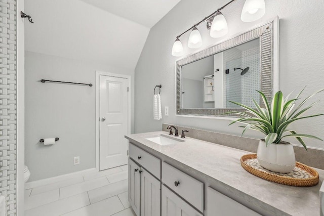 full bathroom with vanity, toilet, baseboards, walk in shower, and vaulted ceiling