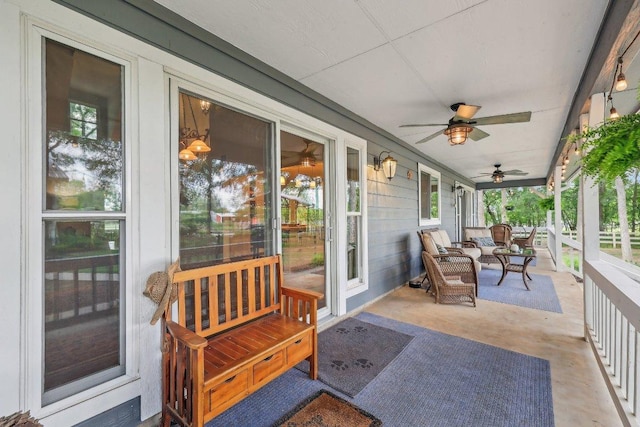exterior space featuring a ceiling fan and a wealth of natural light