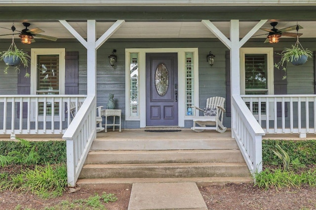 view of exterior entry featuring a porch and a ceiling fan