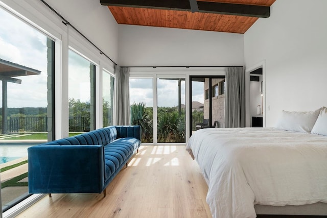 bedroom with wooden ceiling, high vaulted ceiling, and access to exterior