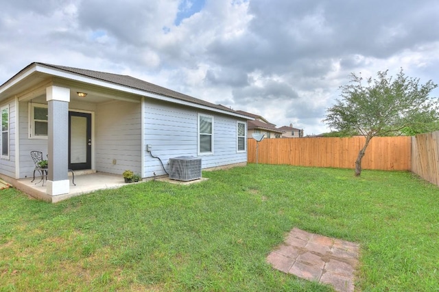 2206 Weiss Ln, Georgetown, TX 78626 - rear view of house with a patio area and central AC unit