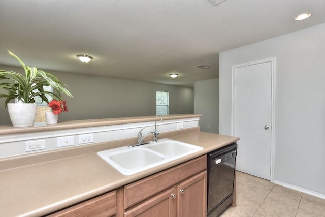 2206 Weiss Ln, Georgetown, TX 78626 - kitchen featuring dishwasher, a sink, light tile patterned floors, light countertops, and baseboards