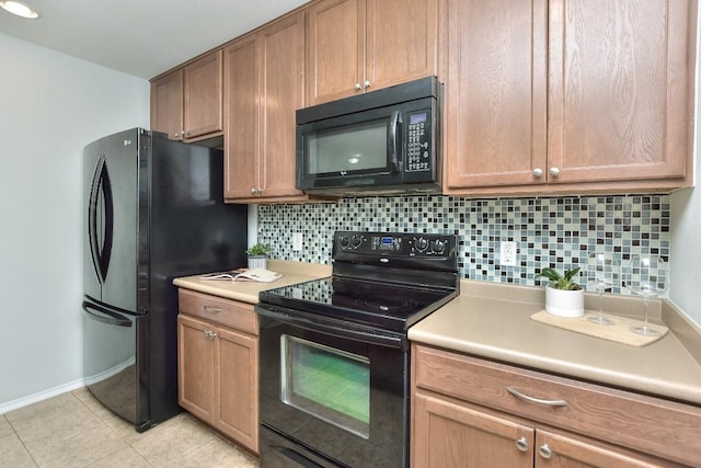 2206 Weiss Ln, Georgetown, TX 78626 - kitchen with black appliances, backsplash, and light countertops