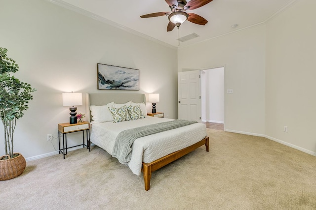 bedroom featuring a ceiling fan, light colored carpet, crown molding, visible vents, and baseboards