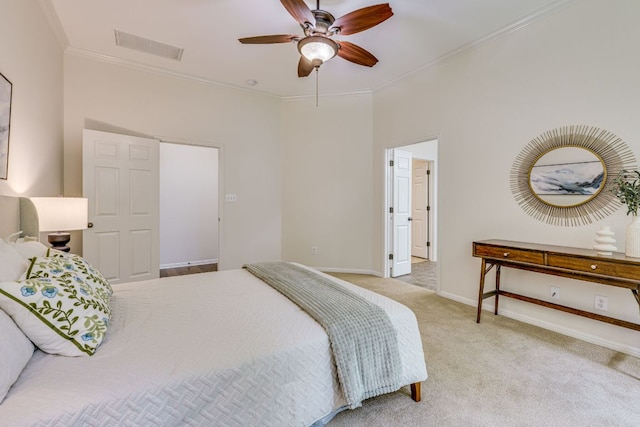 bedroom with a ceiling fan, visible vents, crown molding, baseboards, and carpet