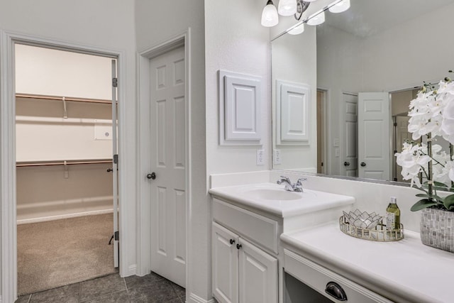 2408 Tivoli Dr, Cedar Park, TX 78613 - bathroom with vanity, a walk in closet, tile patterned floors, and a chandelier