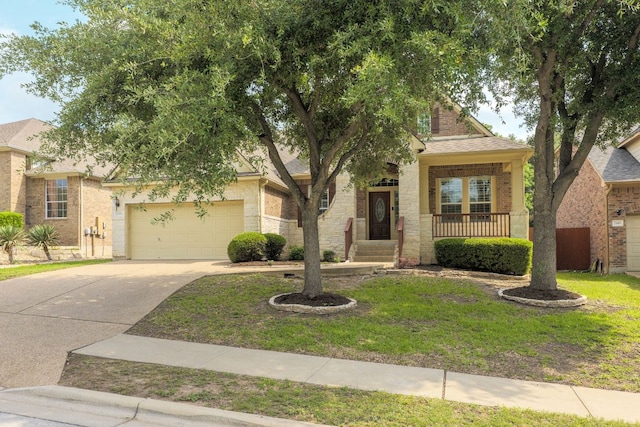 obstructed view of property with a garage, a front yard, brick siding, a porch, and driveway