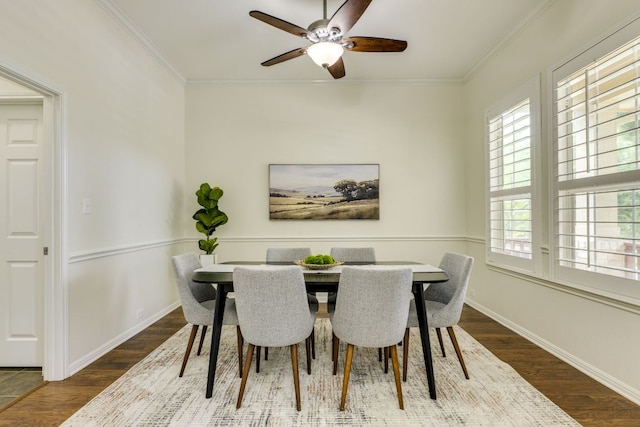 dining room featuring plenty of natural light, ornamental molding, and wood finished floors