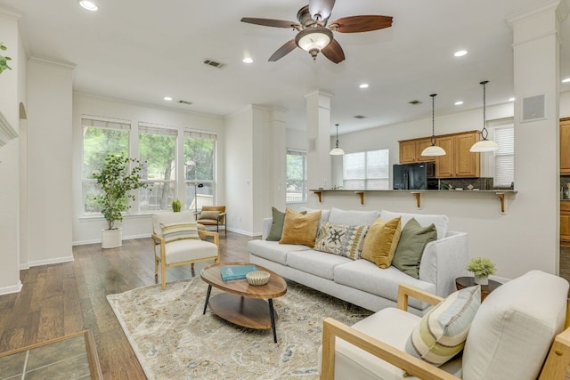 living room featuring recessed lighting, ceiling fan, ornate columns, and visible vents