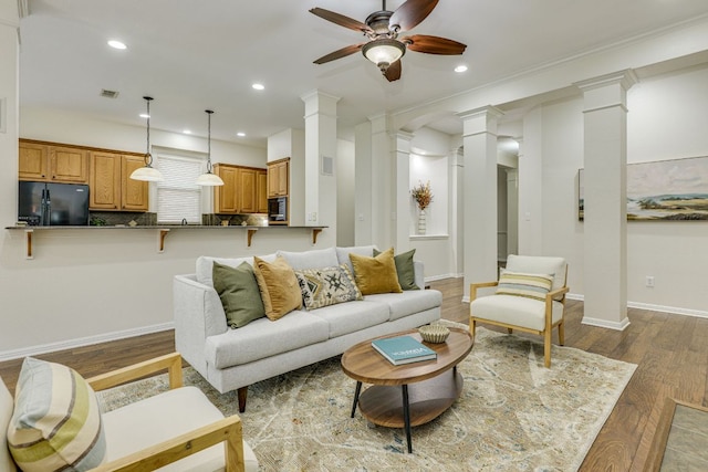 2408 Tivoli Dr, Cedar Park, TX 78613 - living room with decorative columns, ceiling fan, dark wood finished floors, recessed lighting, and baseboards