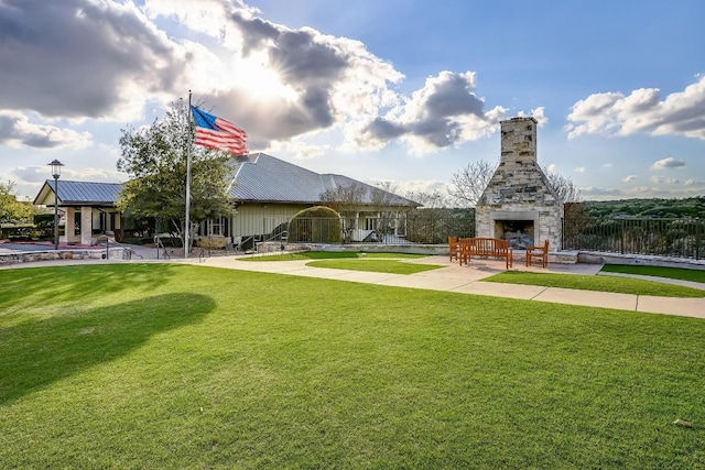 surrounding community featuring a lawn and a patio