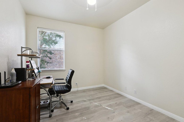 office with baseboards and wood finished floors