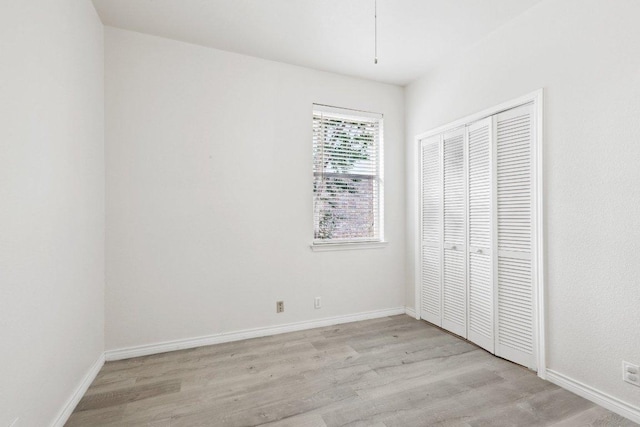 8117 Manx Dr, Round Rock, TX 78681 - unfurnished bedroom with light wood finished floors and a closet