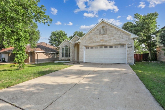 8117 Manx Dr, Round Rock, TX 78681 - view of front of house featuring stone siding, concrete driveway, and a garage