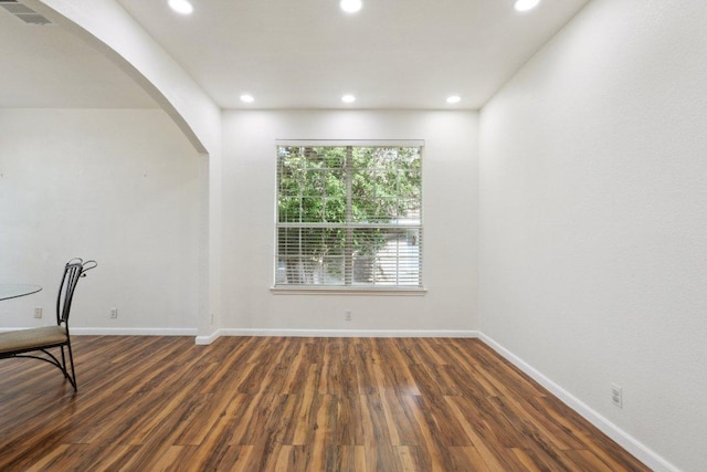 interior space with visible vents, arched walkways, and recessed lighting