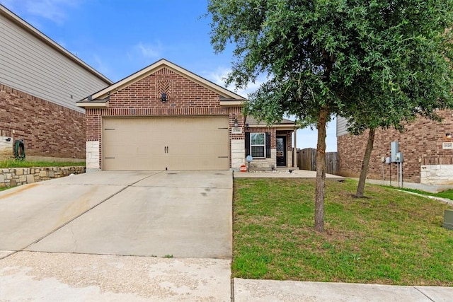 ranch-style house with an attached garage, concrete driveway, a front lawn, and brick siding