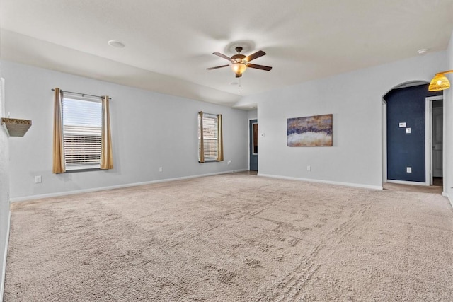 13516 William Mckinley Way, Manor, TX 78653 - unfurnished room featuring a ceiling fan, arched walkways, carpet, and baseboards