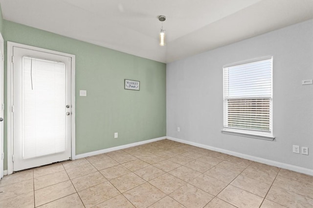 13516 William Mckinley Way, Manor, TX 78653 - spare room featuring light tile patterned floors and baseboards