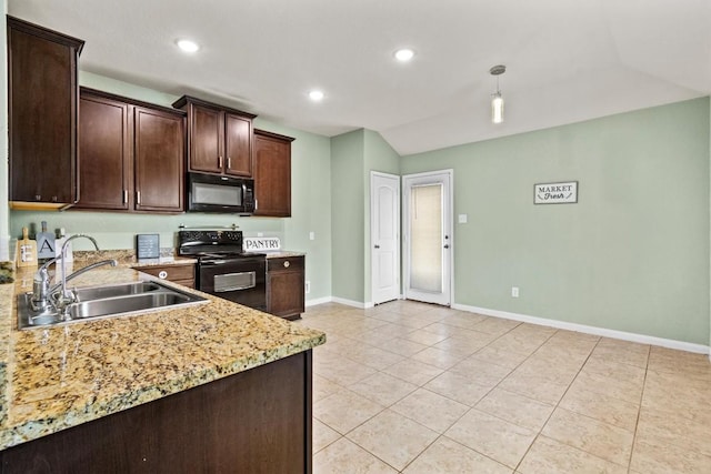 kitchen featuring dark brown cabinetry, a sink, baseboards, vaulted ceiling, and black appliances