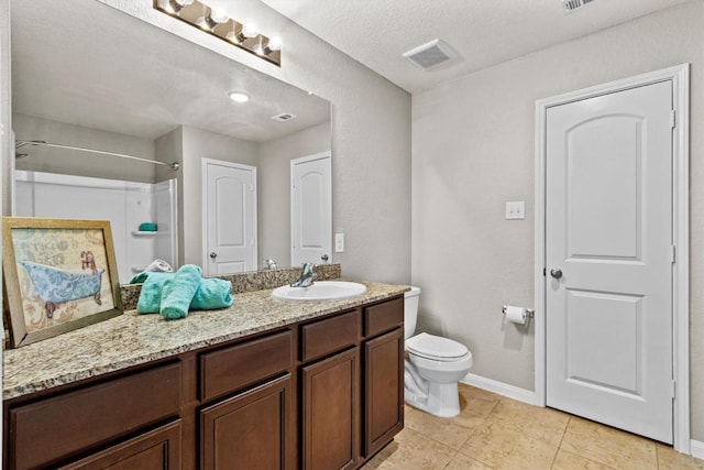 13516 William Mckinley Way, Manor, TX 78653 - full bath with baseboards, toilet, vanity, and tile patterned floors