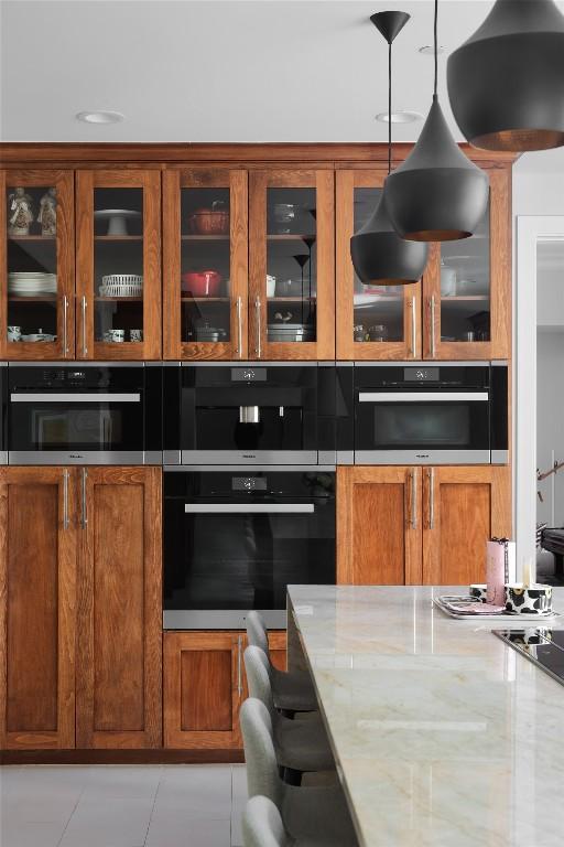 400 Almarion Dr, Austin, TX 78746 - bar with stainless steel double oven and pendant lighting