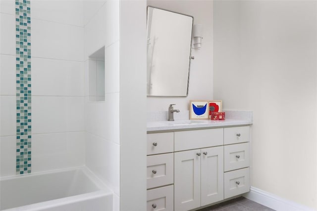 bathroom with vanity and baseboards